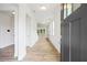 Bright foyer featuring hardwood floors, white walls, and natural light streaming through the windows at 5394 Pebblebrook Se Ln, Mableton, GA 30126