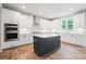 Beautiful kitchen featuring a center island, stainless steel appliances, and ample cabinet space at 5394 Pebblebrook Se Ln, Mableton, GA 30126