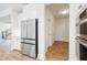 Open kitchen with stainless steel refrigerator and modern oven appliances at 5394 Pebblebrook Se Ln, Mableton, GA 30126