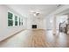 Bright and spacious living room with a modern fireplace, hardwood floors, and large windows at 5394 Pebblebrook Se Ln, Mableton, GA 30126