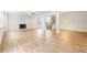 Large open living room with fireplace and hardwood floors throughout the space at 5394 Pebblebrook Se Ln, Mableton, GA 30126