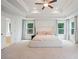 Large main bedroom with tray ceiling, ceiling fan, and plenty of natural light at 5394 Pebblebrook Se Ln, Mableton, GA 30126