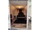 Bedroom with luxe black bedding, recessed lighting, and decorative wall accents viewed through mirrored closet at 856 Haydens Rdg, Ellenwood, GA 30294