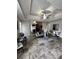 Spacious bedroom with trey ceiling, tile flooring, mirrored closet, and seating area at 856 Haydens Rdg, Ellenwood, GA 30294