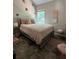 Bedroom featuring gray tile flooring, a full size bed, and a large window at 856 Haydens Rdg, Ellenwood, GA 30294