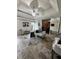 Bedroom with trey ceiling, tile flooring, seating area, mirrored closet, and modern chandelier at 856 Haydens Rdg, Ellenwood, GA 30294