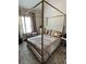 Bedroom featuring tile flooring, full size bed, and metal canopy at 856 Haydens Rdg, Ellenwood, GA 30294