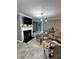 Cozy living room with fireplace, modern lighting, and stylish decor at 856 Haydens Rdg, Ellenwood, GA 30294