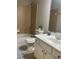 Bathroom featuring a shower-tub combo, a white vanity, and a decorative rug at 727 Pear Grove Pl, Marietta, GA 30066