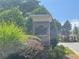 Welcoming Hamilton Grove community entrance with lush landscaping and a charming gazebo in the background at 727 Pear Grove Pl, Marietta, GA 30066