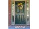 Charming front door adorned with a sunflower wreath, complementing the brick facade and welcoming entryway at 727 Pear Grove Pl, Marietta, GA 30066