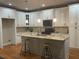 Gourmet kitchen with stainless steel appliances, granite countertops, and custom white cabinets at 727 Pear Grove Pl, Marietta, GA 30066