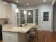 Spacious kitchen island featuring granite countertops, pendant lighting, and barstool seating area at 727 Pear Grove Pl, Marietta, GA 30066
