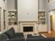 Bright living room with built-in bookshelves flanking the fireplace and ample natural light at 727 Pear Grove Pl, Marietta, GA 30066
