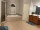 Bright main bathroom featuring a soaking tub, a separate glass-enclosed shower, and a spacious vanity at 727 Pear Grove Pl, Marietta, GA 30066