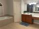 Bright main bathroom featuring a soaking tub, a separate glass-enclosed shower, and a spacious vanity at 727 Pear Grove Pl, Marietta, GA 30066