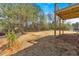 View of the home's backyard from the deck, featuring a gently sloping landscape at 81 Bridgemill Dr, Douglasville, GA 30134