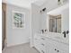 Bright bathroom with double vanity, modern fixtures, and large window with a wooded view at 81 Bridgemill Dr, Douglasville, GA 30134
