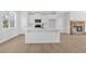 Modern kitchen with white cabinets, stainless appliances, and large center island at 81 Bridgemill Dr, Douglasville, GA 30134