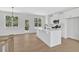 Bright kitchen with white cabinets, stainless appliances, and quartz countertops at 81 Bridgemill Dr, Douglasville, GA 30134