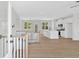 Open-concept living space flows into the modern kitchen with stainless appliances, creating a seamless living experience at 81 Bridgemill Dr, Douglasville, GA 30134