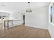 Open living room with natural light and modern lighting fixtures at 81 Bridgemill Dr, Douglasville, GA 30134