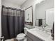Stylish bathroom featuring modern fixtures, a shower curtain, and neutral tones at 2447 Figaro Dr, Atlanta, GA 30339
