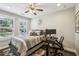 Comfortable bedroom featuring hardwood floors, a ceiling fan, and natural light at 2447 Figaro Dr, Atlanta, GA 30339