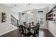 This spacious dining room is filled with natural light and features a decorative chandelier at 2447 Figaro Dr, Atlanta, GA 30339