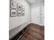 Elegant entryway with hardwood floors, a bench, and stylish wall decor at 2447 Figaro Dr, Atlanta, GA 30339