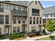 Charming brick townhome with a balcony, manicured landscaping, and inviting curb appeal at 2447 Figaro Dr, Atlanta, GA 30339