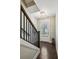Inviting foyer with hardwood floors, staircase, and elegant lighting fixtures at 2447 Figaro Dr, Atlanta, GA 30339