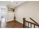 Upstairs hallway with hardwood floors provides access to the bedrooms at 2447 Figaro Dr, Atlanta, GA 30339