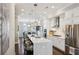 Modern kitchen featuring a large island, stainless steel appliances, and pendant lighting at 2447 Figaro Dr, Atlanta, GA 30339