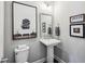 Charming powder room features modern fixtures and eye-catching decor at 2447 Figaro Dr, Atlanta, GA 30339