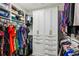 Organized walk-in closet with built-in shelves, hanging rods, and ample storage space at 2447 Figaro Dr, Atlanta, GA 30339