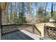 Inviting back deck with lattice railing overlooking the private backyard at 1542 Riderwood Ct, Decatur, GA 30033