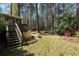 Spacious backyard with a wooden deck, mature trees, and plenty of green space at 1542 Riderwood Ct, Decatur, GA 30033