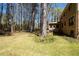 Expansive backyard with lush green grass, surrounded by mature trees and landscaping at 1542 Riderwood Ct, Decatur, GA 30033