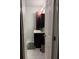 Bathroom with marble floors, dark vanity and modern fixtures at 1542 Riderwood Ct, Decatur, GA 30033