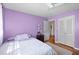 Bedroom with a comfy bed, hardwood floors, and direct access to the en-suite bathroom at 1542 Riderwood Ct, Decatur, GA 30033