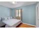 Serene bedroom with hardwood floors, and bright blue walls at 1542 Riderwood Ct, Decatur, GA 30033