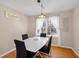 Bright dining room with hardwood floors, a modern table setting, and ample natural light at 1542 Riderwood Ct, Decatur, GA 30033