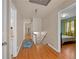 Hallway with hardwood floors leading to bedroom with windows and curtains at 1542 Riderwood Ct, Decatur, GA 30033