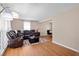 Cozy living room with a plush sectional sofa, hardwood floors, and bright natural light from large windows at 1542 Riderwood Ct, Decatur, GA 30033