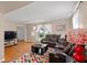 Inviting living room with hardwood floors, a plush sectional, and abundant natural light from the large windows at 1542 Riderwood Ct, Decatur, GA 30033