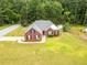 Aerial view of the property showcasing the lawn and mature trees at 15 Fairwoods Ct, Covington, GA 30016