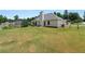Spacious backyard with a well-maintained lawn, patio area, and wooded views at 15 Fairwoods Ct, Covington, GA 30016