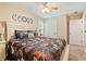 Comfortable bedroom showcases hardwood floors, stylish bedding, and plenty of natural light creating a peaceful ambiance at 15 Fairwoods Ct, Covington, GA 30016