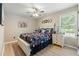 Stylized bedroom with a decorative bed, hardwood floors, and modern decor creates a relaxing retreat at 15 Fairwoods Ct, Covington, GA 30016